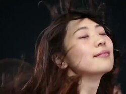 CU SLO MO Woman moves head from side to side,hair moving in wind / London, Greater London, United Kingdom Stock Footage