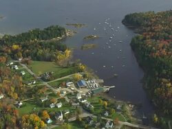 MS AERIAL TU View of small town in wooded area at bay / Maine, United States Stock Footage