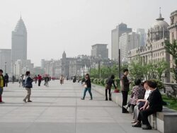 MS People walking at Shanghai Bund near buildings / Shanghai, China Stock Footage