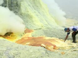  MS PAN Miners working on the sulfur extraction at Ijen volcano crater / Ijen, Java, Indonesia Stock Footage
