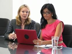 Businesswomen in conference room smiling Stock Footage