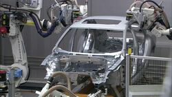 Robots weld an auto body frame in an automotive plant. Stock Footage