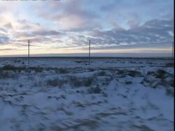 View from car driving across snowy landscape, Manitoba, Canada Stock Footage