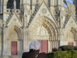 Elderly woman in front of church Stock Footage