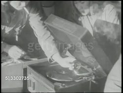 1942: JAPANESE AIR BASE: VS Japanese soldiers, pilots, listening to records, music, in tent, camp. VS Japanese soldiers playing baseball outdoors, soldiers watching. World War II, WWII, Pacific Front, leisure, recreation Instructional Video