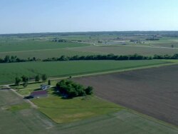 Patchwork of fields, lakes and farm houses Stock Footage
