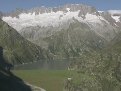 WS POV  View of mountains over lake GÃƒÂ¶schneralpsee / Abfrutt, Uri, Switzerland Stock Footage