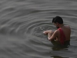 MS HA Man bathing in Ganges river / Varanasi, India Stock Footage
