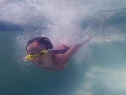 Little Girl Jumps Into the Pool Stock Footage