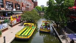 Oklahoma City Oklahoma OKC Bricktown Canal with boats and restaurants downtown Stock Footage