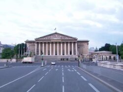 POV push-in - Vehicles turn in front of the French National Assembly building in Paris. / Paris, France Stock Footage