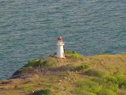 MS AERIAL DS ZO View of lighthouse on island in ocean / Queensland, Australia Stock Footage