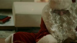 Santa Clause brings presents to familys house Stock Footage