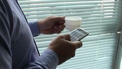 Businessman analyzing data on mobile Stock Footage