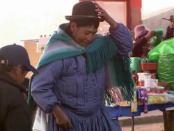 Woman buying fresh goods from street trader, Copacabana, Bolivia Stock Footage