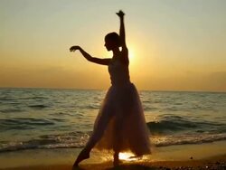 ballerina dancing on the beach Stock Footage