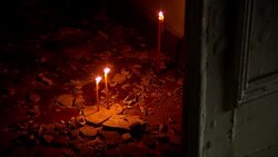 Crowds enter burnt out trade union building, lay flowers at entrance News Clip