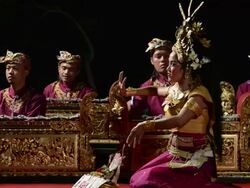 MS Balinese girl dancer is performing Tari Penyambutan Dance ( Goddess of Moon ) in front of Gamelan Orchestra in Puri Saraswati temple AUDIO / Ubud, Bali, Indonesia, Asia Stock Footage