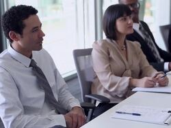 WS PAN R/F Group of coworkers in discussion at conference table/Washington, USA Stock Footage