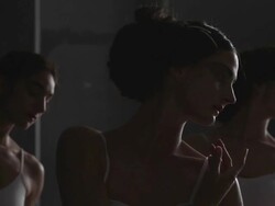 Three ballerinas performing arabesque, penchÃƒÂ©e, and pirouette Stock Footage