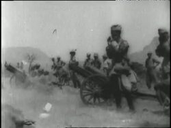 Bombs fall to the ground, soldiers shoot cannons, and Ethiopian emperor Haile Selassie leads troops while riding a white horse. News Clip