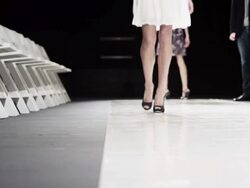 MS LA Designer looking at fashion models practicing on catwalk before fashion show Stock Footage