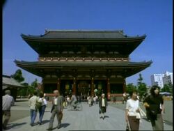 MS Low angle, people walking to and from Sensoji temple, Asakusa, Tokyo, Japan Stock Footage
