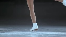 SLO MO Female figure skates in a spin Stock Footage