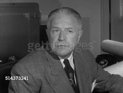 1952: CANADA: SHIPPING INDUSTRY: Canadian Minister of Transport Lionel Chevrier sitting at desk SOT saying no discrimination against any vessel, cost born by those who benefit, Instructional Video