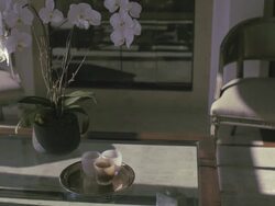 Focus on glass top coffee table, patterns of sunlight move across floor. Stock Footage