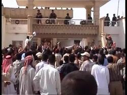 Iraqis burn Japanese flags in town where troops based, reax News Clip