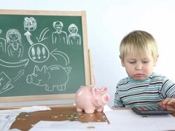 little boy and money from piggy bank Stock Footage
