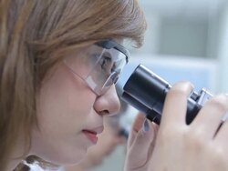 HD : Scientist using microscope Stock Footage