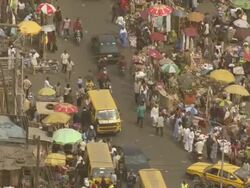 WS AERIAL View of streets with bike rolling and entrance crossroad / Lagos, Nigeria Stock Footage