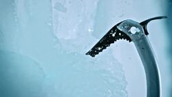 SLO MO axe spike bites the ice Stock Footage