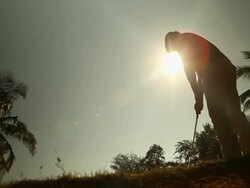 Low angle view of a man playing golf  Stock Footage