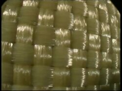ECU Panning right across Kevlar fabric fibres Stock Footage