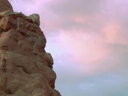 TD Rock tower and natural arch alongside other rocky formations at Arches National Park / Utah, United States Stock Footage