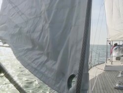 MS Pensioner standing on his sailboat on calm day / Wismar, Mecklenburg-Vorpommern, Germany Stock Footage