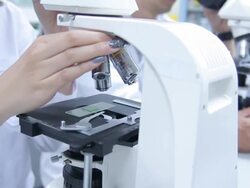 HD : Scientist Couple using microscope Stock Footage