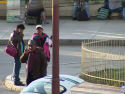 Family with small baby on street corner, Cochabamba, Bolivia Stock Footage