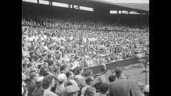 Crowd watches tennis match between Doris Hart and Shirley Fry News Clip