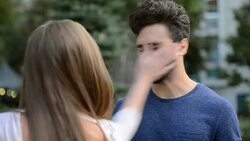 woman slapping his friend on the street Stock Footage