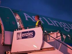 Airport staff converse at door to Aer Lingus aeroplane, Northern Ireland Stock Footage
