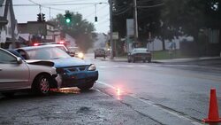 Police car at car crash Stock Footage