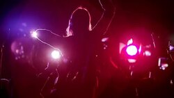 Crowd raising arms at concert with person sitting on shoulders Stock Footage
