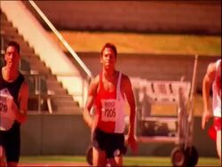 MS athletes running to camera on track, Australia Stock Footage