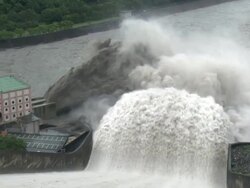Flood Water Flows Down Spillway Of Hydroelectric Dam Stock Footage