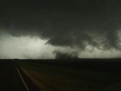 Tornado starts to form, big dust swirl, weak tornado close by, handheld, POV from inside car, South Plains, Texas, USA Stock Footage