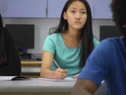 Confident Female Student Interacts in Classroom Setting Stock Footage